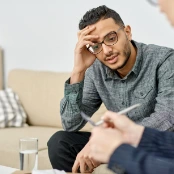 Man sitting in therapy setting